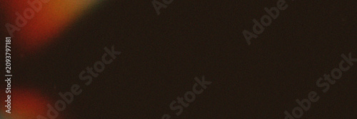 Blurred red and black light leak with dark background
