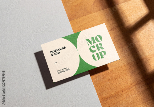 Business Card Mockup with Window Shadow on Wood and Paper Surface