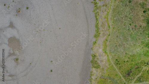 Aerial view of the intertidal mudflats and vegetation on the coast at Grange over Sands in Cumbria