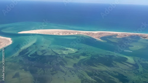 Flying over Faro coastline in Portugal