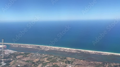 Flying over Faro coastline in Portugal