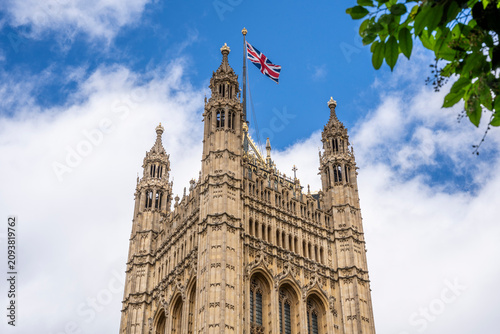 The Victoria Tower of the Palace of Westminster seen from College Garden. The 98.5-metre Gothic Revival tower was designed by Charles Barry, London, UK.