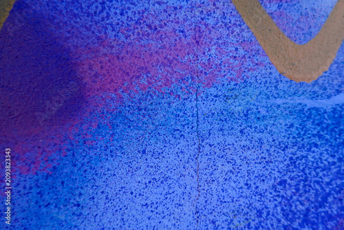 Vibrant urban graffiti wall with colorful spray paint texture and street art details