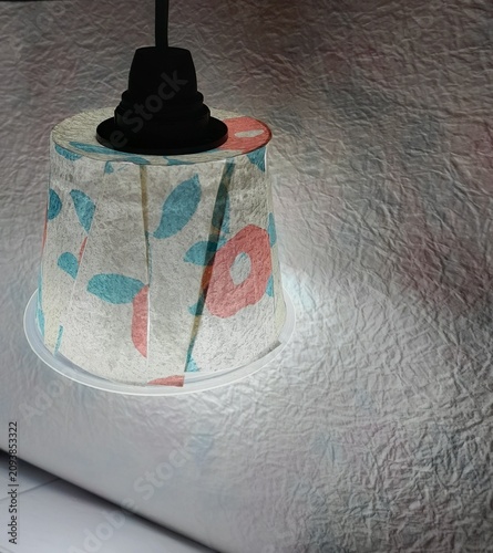 Small lamp made with plastic yogurt cup and fine japanese paper