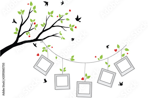 Photos Tree branch with green leaves red hearts and blank picture frames hanging from a