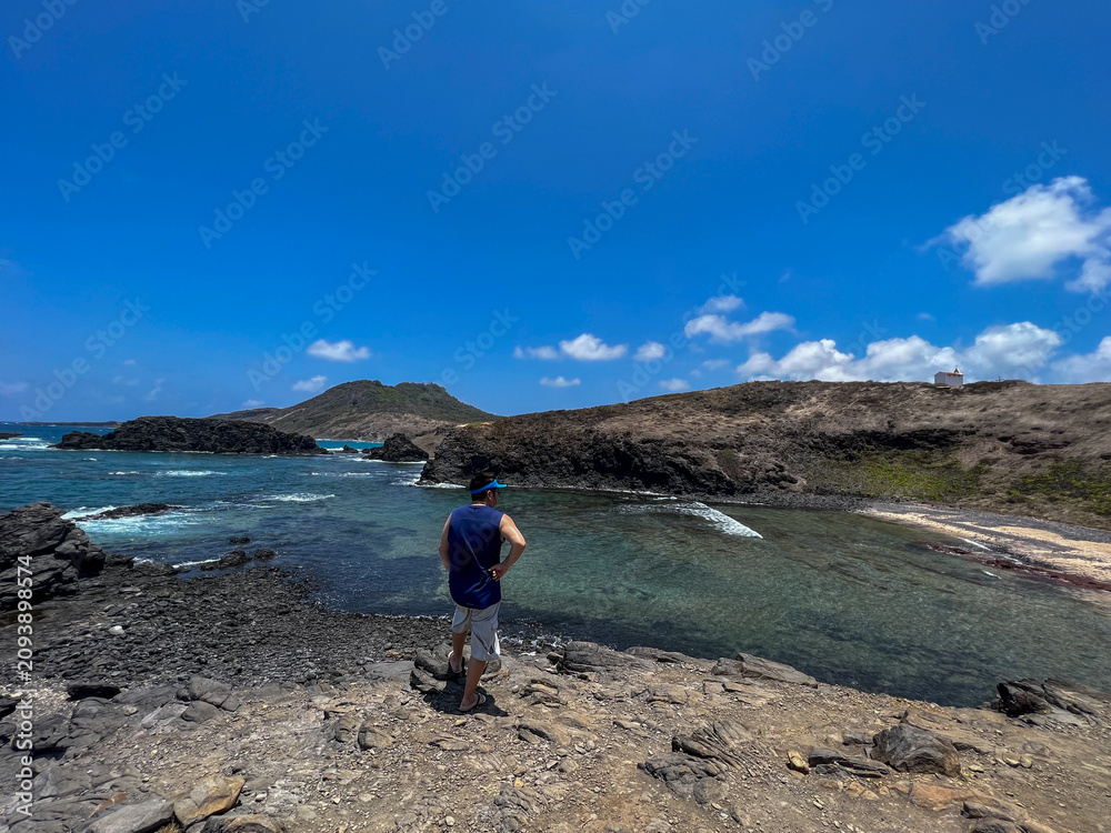 Fototapeta premium Brazil, Fernando de Noronha - 2023, September : man in Caieira Beach 