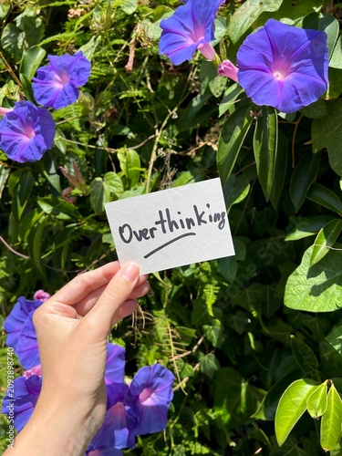 Overthinking - note with purple flowers in background, vertical card with psychology issues concept