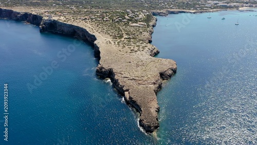 Bild auf Leinwand Punta Prima is a rocky cape on the southeastern coast of Formentera, surrounded by transparent waters and natural landscapes that showcase the island’s peaceful Mediterranean character