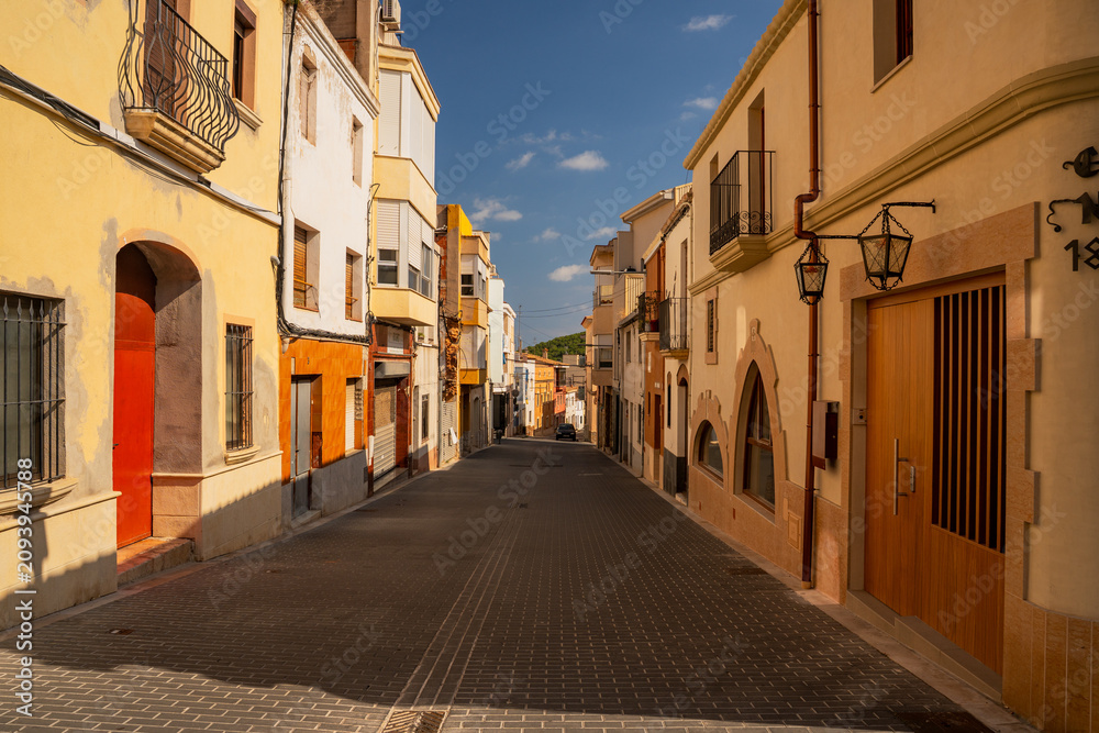 Obraz premium Epic narrow empty old town street vertical panorama historic stone buildings facade. 