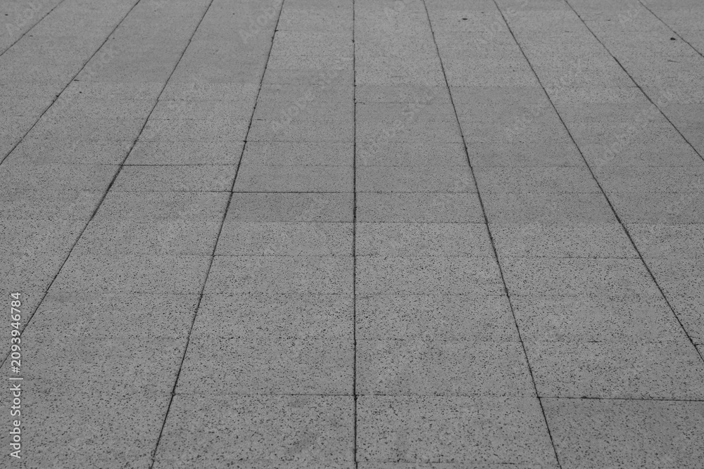 Obraz premium empty stone floor top in perspective. grey tile floor background in perspective view. line. empty copy space stone street. pavement. Granite outdoor tiled floor. gray granite. Marble texture