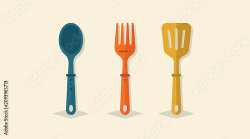Photos Spoon, fork, and spatula are arranged in a neat row against a plain background for culinary use