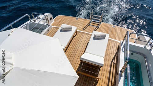 Luxury Superyacht Aft Deck with Premium Teak Flooring Sun Loungers and Crystal Blue Ocean Under Bright Sunlight