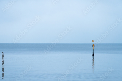 marker in the ocean in the morning