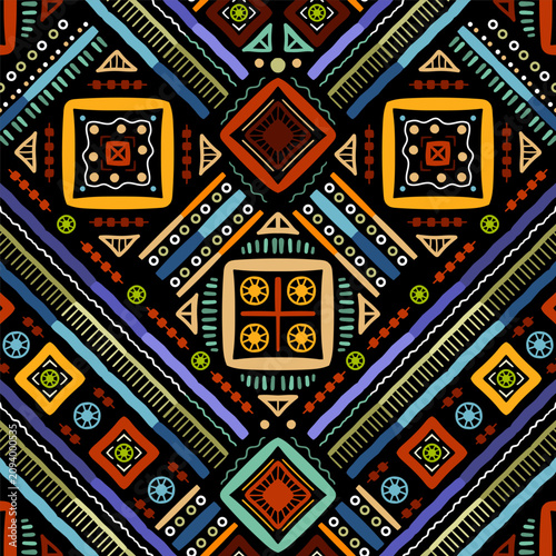 Zigzag tribal chevron seamless pattern. African, Aztec. Geometric vector oriental background. Multicolor backdrop with triangles, dots, and diamonds. Mayan Lines, stripes.