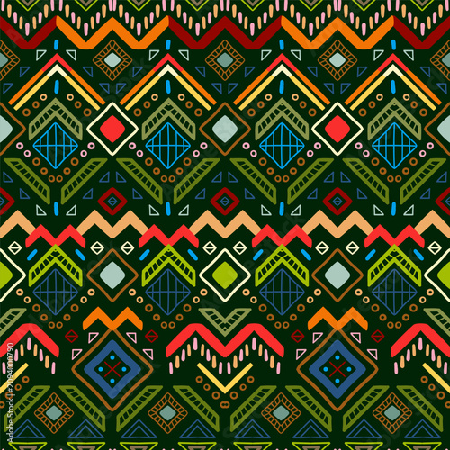 Zigzag tribal chevron seamless pattern. African, Aztec. Geometric vector oriental background. Multicolor backdrop with triangles, dots, and diamonds. Mayan Lines, stripes.