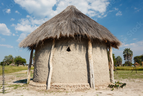 Obraz na płótnie Closeup of traditional native mud hut with small window in Botswana, Africa