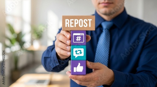 Businessman holding colorful blocks with icons sees text REPOST. Repost sharing viral content online concept. Repost social media web information technology.New Concept
