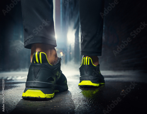Close-up Urban Sneakers Standing on Wet Road at Night Street View Commercial