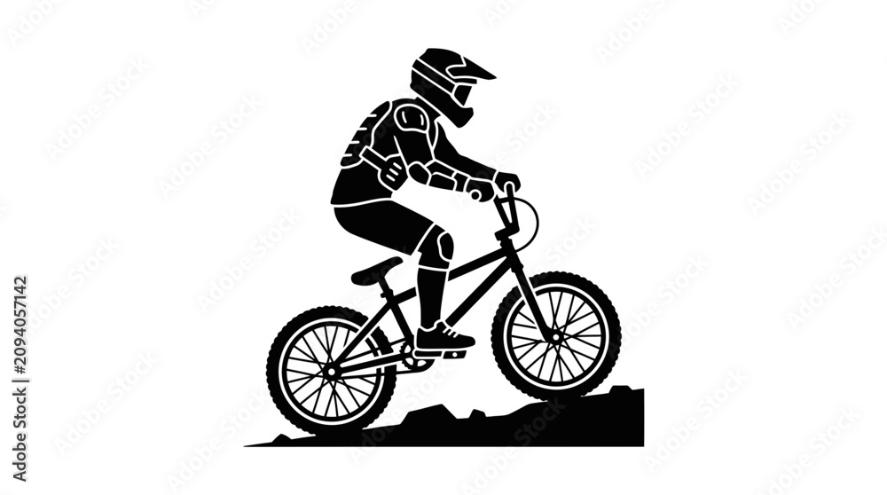 Fototapeta premium Silhouette of a downhill mountain biker riding on a rocky trail