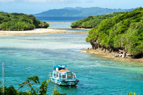 Tour Boat on Turquoise Lagoon in Okinawa, Japan