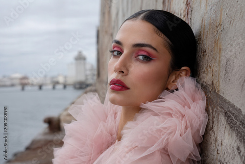 Elegant Woman in Pink Tulle Couture by Historic Waterfront