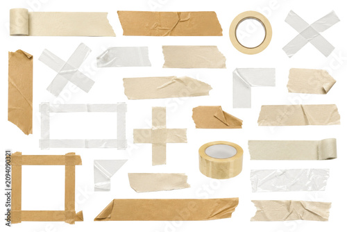 Various masking tapes and paper shapes on a surface for crafting.