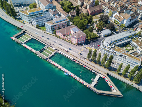 Fotografie Drone image of the public swimming pool in the nature water on the Rhine river b