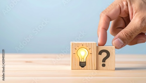 Hand moving a question block beside a glowing idea icon, illustrating solutions, innovation, and creative thinking.
