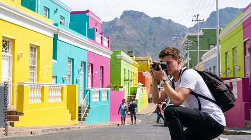 Young Male Tourist Photographer Capturing Colorful Bo-Kaap Houses in Cape Town South Africa
