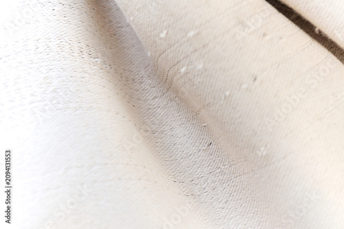 Close up view of cream colored canvas fabric texture