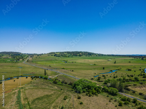 A beautiful view of the town of Glen Innes with fields and large trees