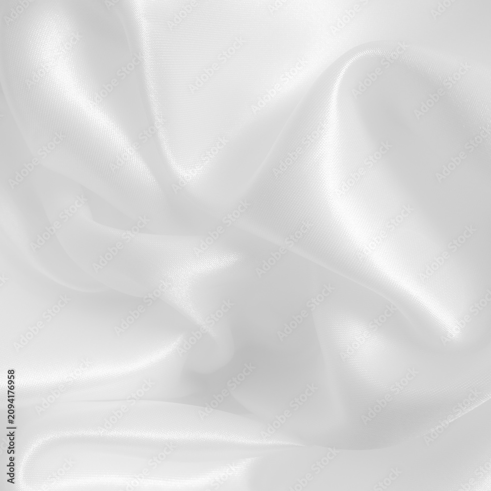 Fototapeta premium White fabric background. Wavy cloth texture