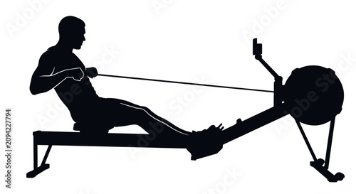 Man training on indoor rowing machine silhouette.