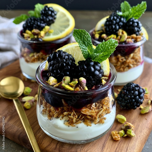 Healthy Greek Yogurt Parfait with Blackberries Blueberry Compote and Pistachios