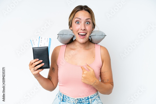Foto Woman with Inflatable Travel Pillow over isolated background with surprise facia