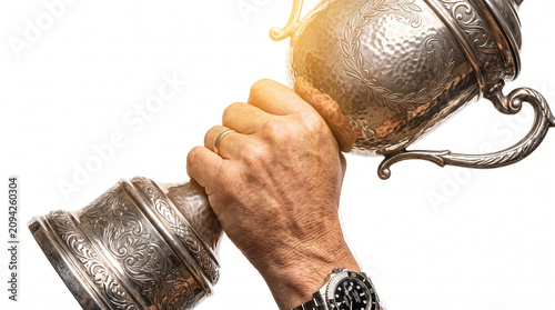 Hand holding silver winner cup