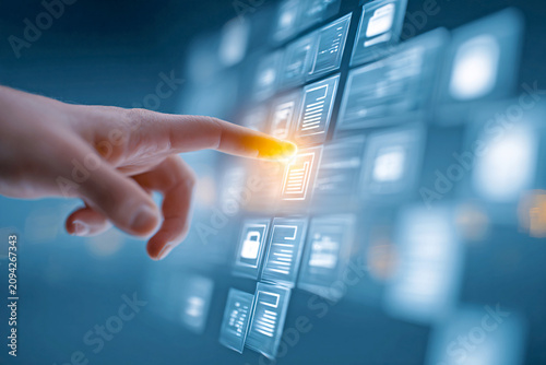 Person interacting with futuristic digital interface with glowing icons