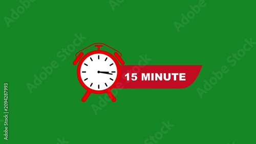 Red alarm clock with 15 minute text on green background white clock face black hands