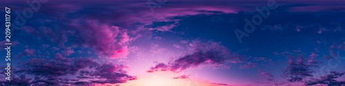 Sunset panorama sky with dramatic purple and magenta clouds over a glowing horizon for landscape background design