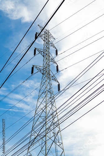 High voltage electric pole power line electric transmission tower background, technology energy clean ecosystem change green environment, substation construction pylon generator grid electricity.