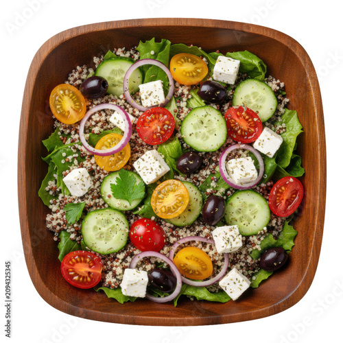 A vibrant quinoa salad in a dark brown wooden bowl, featuring tri-color quinoa, green lettuce, red and yellow cherry tomatoes, cucumber, red onion, Kalamata olives, feta, and herbs on a stark white