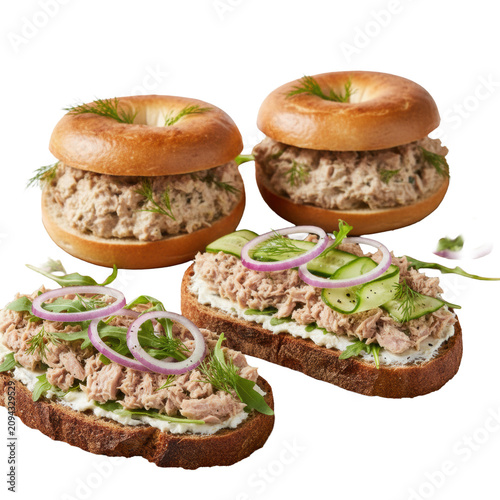 Toasted bagels with tuna salad and sourdough sandwiches topped with red onion and arugula on a minimalist white background. Fresh gourmet breakfast concept
