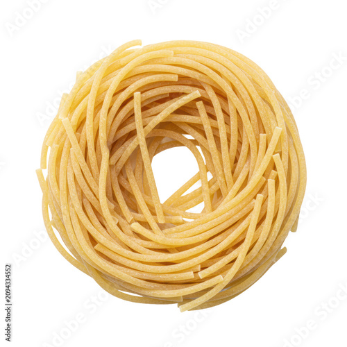 A circular nest of dry durum wheat spaghetti strands with a pale golden hue and firm texture isolated on a bright white background culinary preparation concept