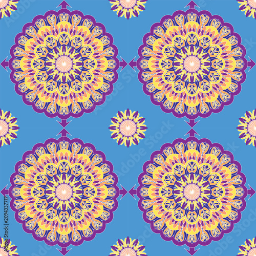 Seamless floral mandala with golden and purple petals on a sky-blue background. Perfect for textiles, wallpaper, apparel, home décor, gift wrap, stationery, and surface pattern design.