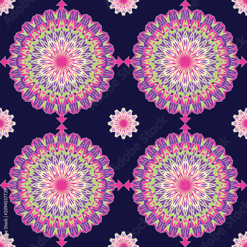 Seamless mandala featuring vibrant pink, green, and lavender floral layers on a dark navy background. Ideal for fabric, wallpaper, packaging, home décor, fashion, and digital prints.