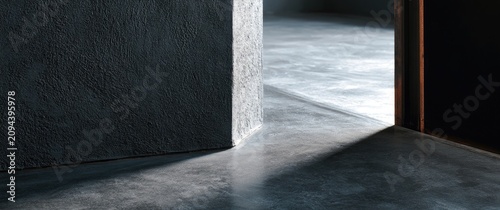 Minimalist interior with textured wall and light casting shadows on concrete floor