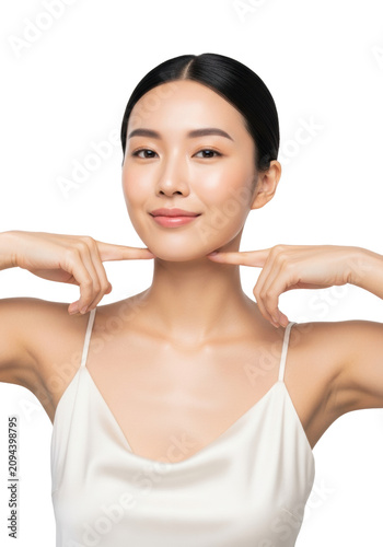 young east asian woman with flawless dewy skin, wearing ivory silk, posing in a tight head-and-shoulders close-up against a transparent background, serene look, concept of luxury skincare and wellness