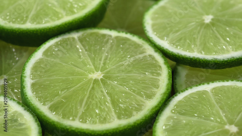 Close-up of numerous lime slices overlapping each other