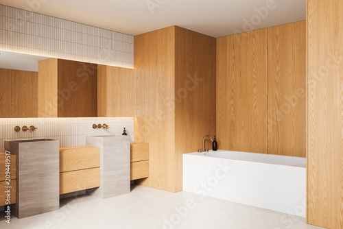 Minimalist wooden bathroom interior featuring modern stone sinks, a sleek white bathtub, warm lighting accents, and refined architecture elements. 3D Rendering