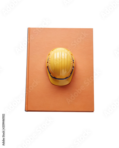 A smiling yellow hard hat sits on an orange square object.